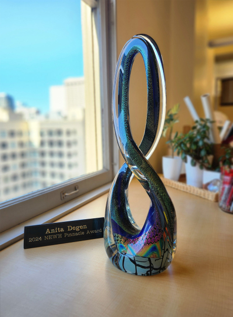 Beautiful, colorful glass trophy in shap similar to an infiinty symbol