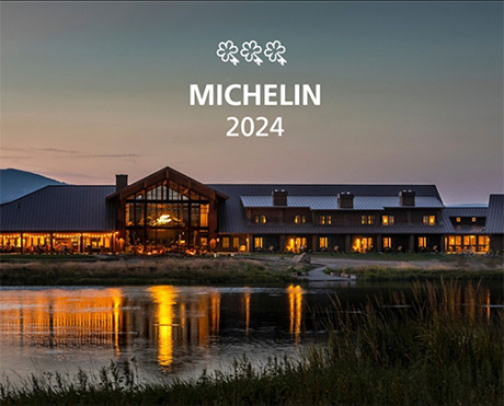 Sage Main Lodge at dusk looking across the fishing pond